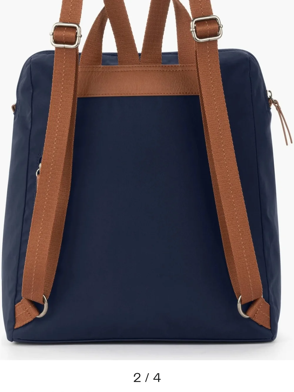 The Sak Navy Backpack with Brown Trim and Straps